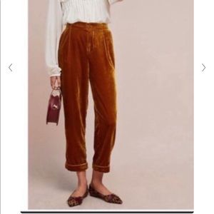 Anthropologie orange velvet pleated trousers
